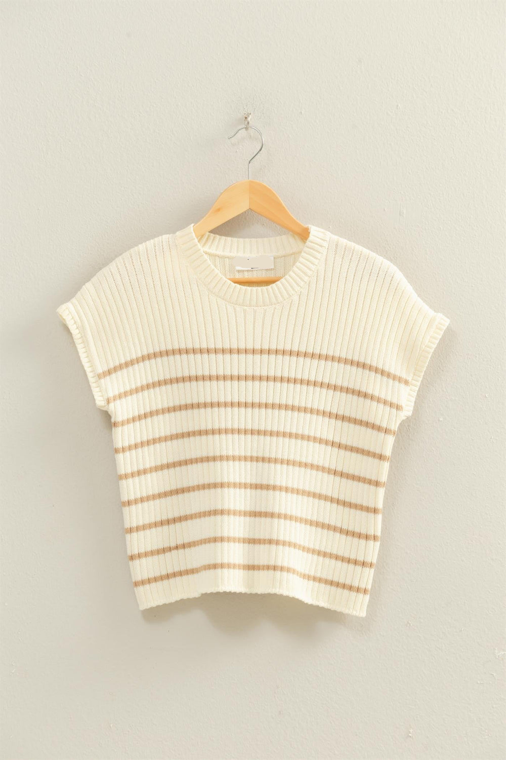 Striped sleeveless top on a hanger against a plain background