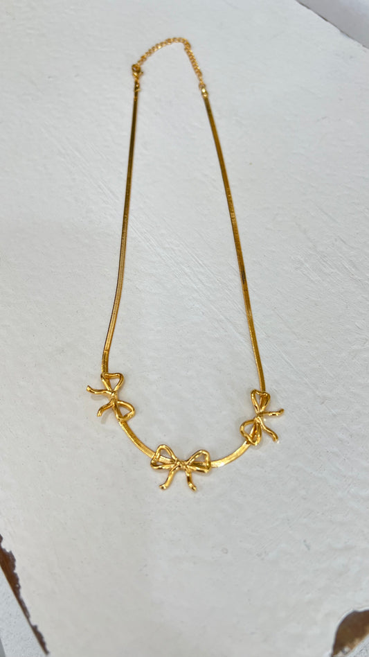 Gold bows necklace