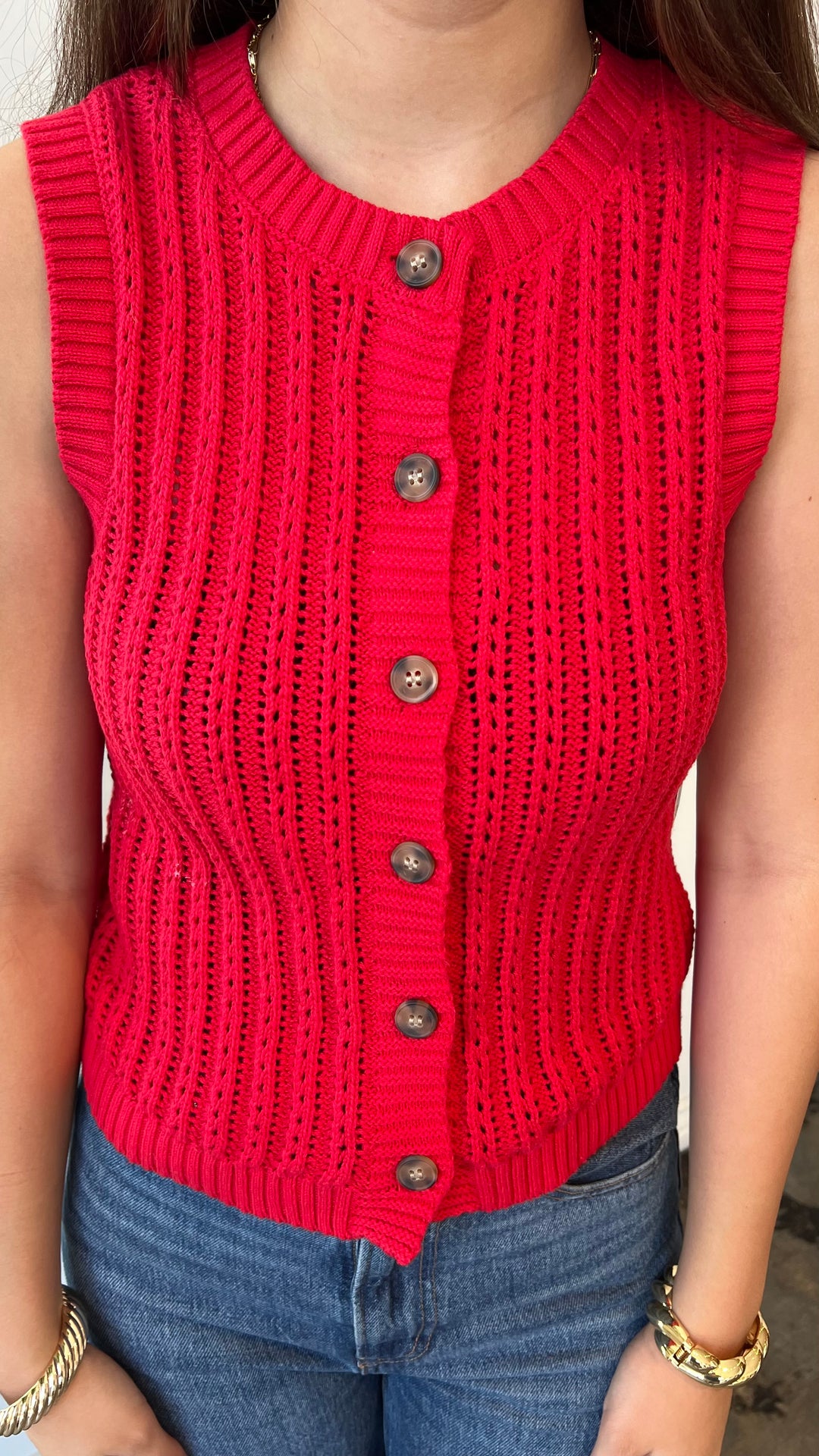 Close-up of red pointelle knit tank top with buttons