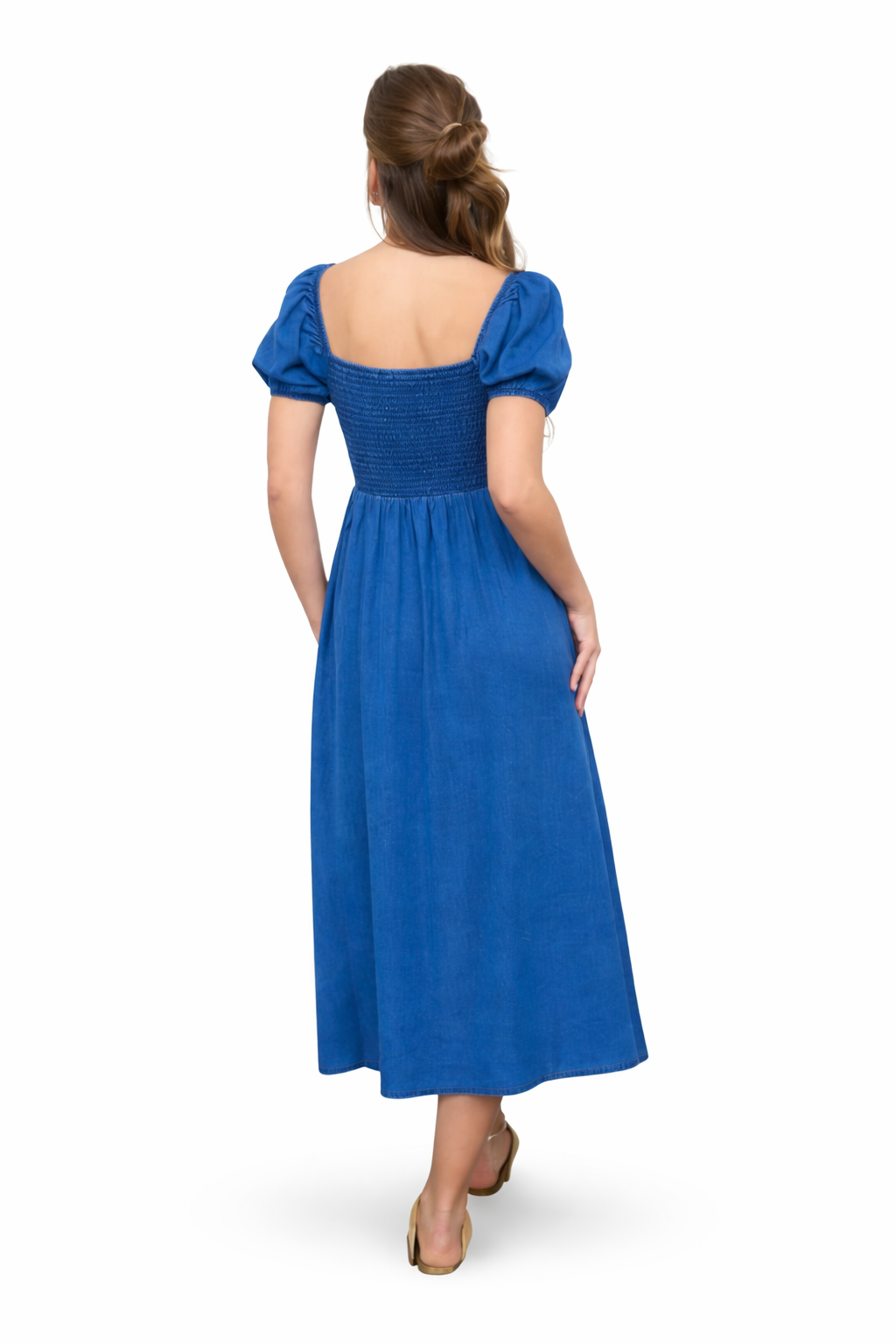 Back view of chambray blue smocked midi dress with puff sleeves and flowy skirt on white background